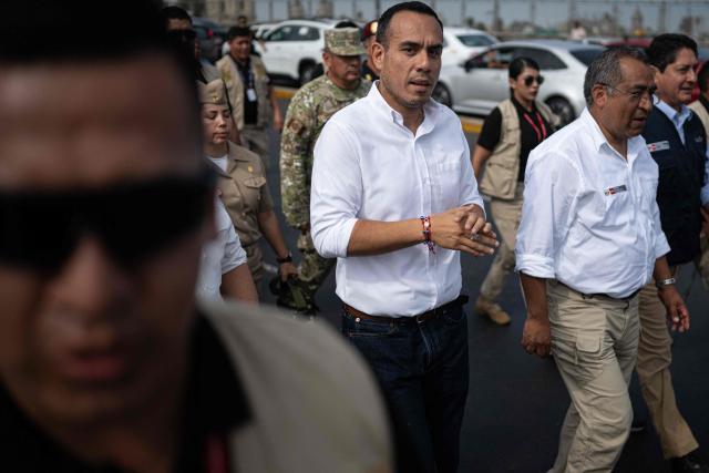 (FILES) Peru’s interim president Jose Jeri walks to a meeting with transport union leaders during a strike called by public transport companies against extortion and to demand greater security in Lima on January 14, 2026. Peru's attorney general confirmed on January 19, 2026, that he had opened a preliminary investigation into interim Peruvian president Jose Jeri for the alleged crime of influence peddling for meeting with a Chinese businessman without officially informing his collaborators. (Photo by ERNESTO BENAVIDES / AFP)