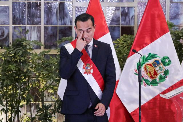 (FILES) Peru's interim President Jose Jeri gestures during the inauguration ceremony of his cabinet at the Presidential Palace in Lima on October 13, 2025. Peru's attorney general confirmed on January 19, 2026, that he had opened a preliminary investigation into interim Peruvian president Jose Jeri for the alleged crime of influence peddling for meeting with a Chinese businessman without officially informing his collaborators. (Photo by CONNIE FRANCE / AFP)