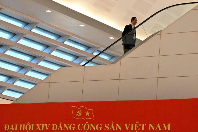 A delegates arrives to attend the opening ceremony of the 14th National Congress of the Communist Party of Vietnam at the National Convention Centre in Hanoi on January 20,2026. (Photo by Nhac NGUYEN / AFP)