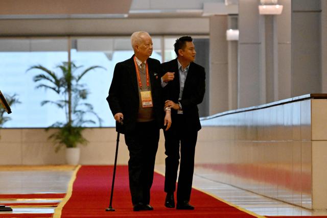 Delegates arrive to attend the opening ceremony of the 14th National Congress of the Communist Party of Vietnam at the National Convention Centre in Hanoi on January 20,2026. (Photo by Nhac NGUYEN / AFP)