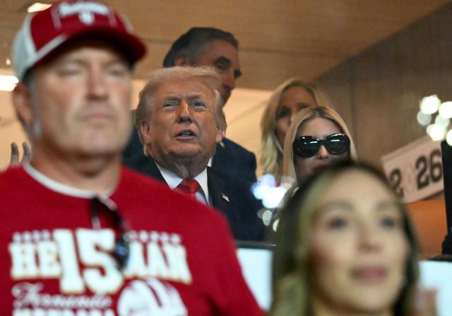 US President Donald Trump and his daughter Ivanka Trump attend the College Football National Championship Game between the Miami Hurricanes and the Indiana Hoosiers at Hard Rock Stadium in Miami Gardens, Florida, on January 19, 2026. (Photo by ANDREW CABALLERO-REYNOLDS / AFP)