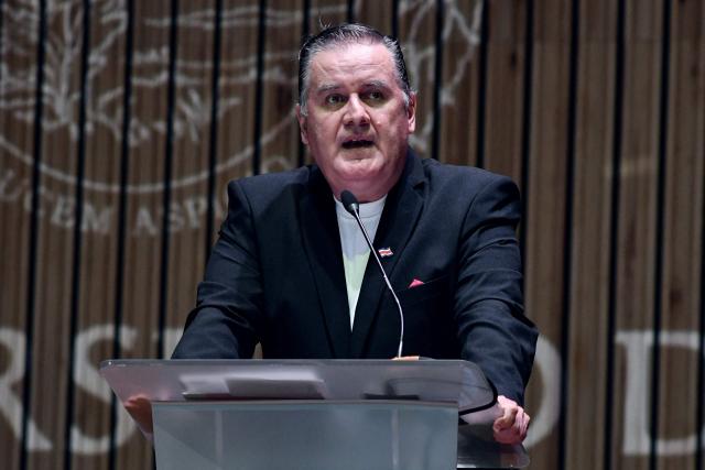 Costa Rica's presidential candidate of the Alianza Costa Rica Primero party, Douglas Caamano, speaks during a debate at the University of Costa Rica in San Jose on January 19, 2026. Costa Rica will hold a presidential election on February 1, 2026. (Photo by EZEQUIEL BECERRA / AFP)