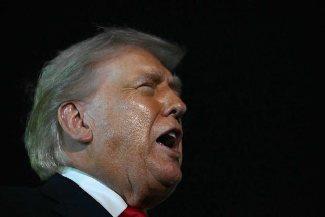 US President Donald Trump speaks with reporters before boarding Air Force One at Palm Beach International Airport, in West Palm Beach, Florida on January 19, 2026. President Trump is returning to Washington after spending the weekend at his Mar-a-Lago residence and attending the College Football National Championship Game between Miami Hurricanes and Indiana Hoosiers at Hard Rock Stadium in Miami Gardens, Florida. (Photo by ANDREW CABALLERO-REYNOLDS / AFP)