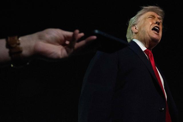 US President Donald Trump speaks with reporters before boarding Air Force One at Palm Beach International Airport, in West Palm Beach, Florida on January 19, 2026. President Trump is returning to Washington after spending the weekend at his Mar-a-Lago residence and attending the College Football National Championship Game between Miami Hurricanes and Indiana Hoosiers at Hard Rock Stadium in Miami Gardens, Florida. (Photo by ANDREW CABALLERO-REYNOLDS / AFP)