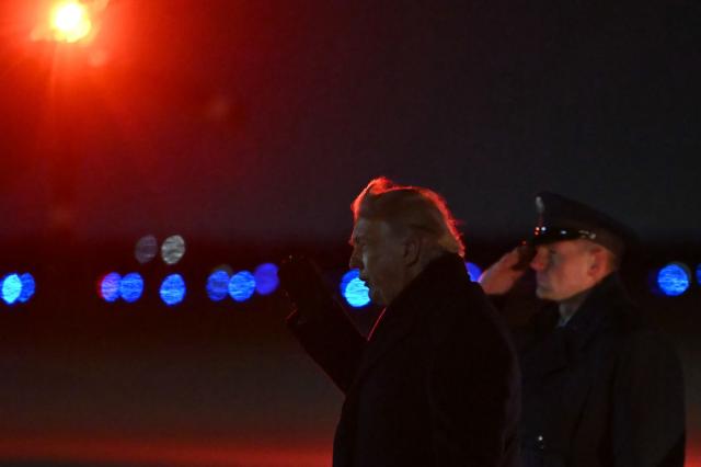 US President Donald Trump steps off Air Force One at Joint Base Andrews in Maryland in the early hours of January 20, 2026 after spending the weekend at his Mar-a-Lago residence and attending a college football game in Florida. Later in the day, President Trump will be heading to the Swiss ski resort of Davos to attend the World Economic Forum (WEF). (Photo by ANDREW CABALLERO-REYNOLDS / AFP)
