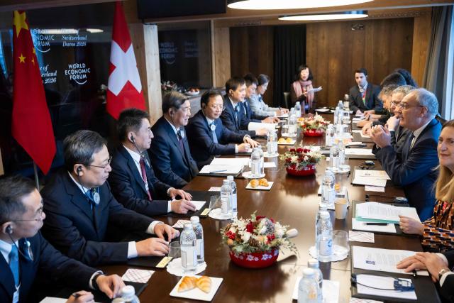 Switzerland's President Guy Parmelin (2R) speaks with China’s Vice Premier He Lifeng (4L) during a bilateral meeting on the sidelines of the World Economic Forum (WEF) annual meeting in Davos on January 20, 2026. The World Economic Forum takes place in Davos from January 19 to January 23, 2026. (Photo by LAURENT GILLIERON / POOL / AFP)