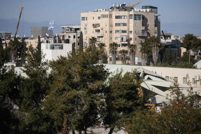 A photograph shows a demolished structure inside the headquarters of the United Nations Relief and Works Agency (UNRWA) in the Sheikh Jarrah neighbourhood of Israeli-annexed east Jerusalem on January 20, 2026. The chief of the UN's agency for Palestinian refugees denounced the Israeli authorities' seizure of assets from its east Jerusalem compound earlier this month, which police told AFP was part of a debt-collection operation. The compound in Israeli-annexed east Jerusalem has been empty of UNRWA staff since January, when the law banning its operations took effect after a months-long battle over its work in the Gaza Strip. Israel had accused UNRWA of providing cover for Hamas militants, and the legislation also forbids contact between the agency and Israeli officials. (Photo by ilia yefimovich / AFP)