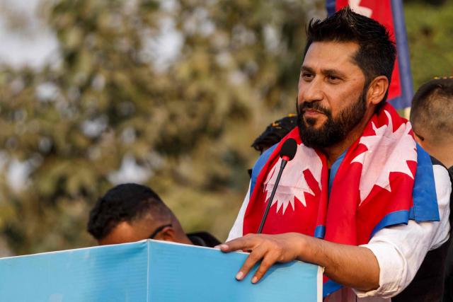 Rastriya Swatantra Party (RSP) chairman and television host Rabi Lamichhane addresses supporters during an election rally in Janakpur on January 19, 2026. Nepal's rapper-turned-politician Balendra Shah of RSP is carrying youth demands that helped topple last year's government into a head-to-head election battle with the veteran prime minister he helped unseat. Nepal will hold general elections on March 5, the first since mass anti-corruption protests in September 2025 overthrew KP Sharma Oli, a 73-year-old Marxist leader and four-term prime minister. (Photo by Sumit MISHRA / AFP)