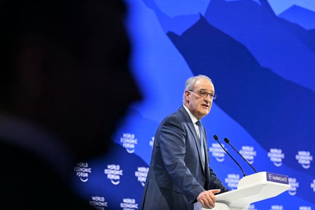 Switzerland's President Guy Parmelin delivers a speech during the World Economic Forum (WEF) annual meeting in Davos on January 20, 2026. The World Economic Forum takes place in Davos from January 19 to January 23, 2026. (Photo by Fabrice COFFRINI / AFP)
