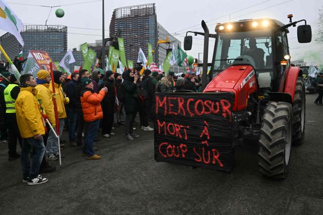 A placard on a tractor reads "Mercosur, dead for sure" as European farmers gather in front of the European Parliament to protest against the free trade agreement between the European Union and the Mercosur countries, on the eve of a vote on a referral to the courts, in Strasbourg on January 20, 2026. Called by the FNSEA, France's leading national agricultural union, some 4,000 farmers from across the European Union, including Italy, Belgium, and Germany, are expected to attend the protest. MEPs will not vote on the entire agreement with Mercosur until the coming months, but they are set to vote on Wednesday on whether to refer the matter to the Court of Justice of the European Union (CJEU). (Photo by NICOLAS TUCAT / AFP)