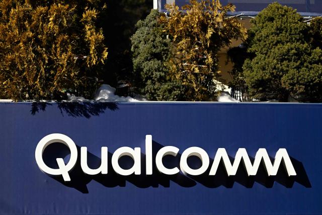 This photograph taken on January 20, 2026 shows the logo of US Semiconductor company Qualcomm in the Alpine resort of Davos during the World Economic Forum (WEF) annual meeting. The World Economic Forum takes place in Davos from January 19 to January 23, 2026. (Photo by INA FASSBENDER / AFP)