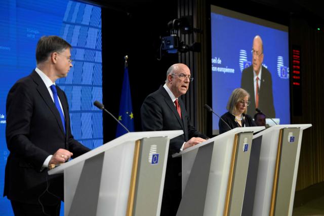 EU Commissioner for Economy and Productivity, Implementation and Simplification Valdis Dombrovskis (L) and Cyprus's Finance Minister and Acting President of the Eurogroup Makis Keravnos (C) give a press conference during the Ecofin Economic and Financial Affairs Council, at the EU headquarters in Brussels, on January 20, 2026. (Photo by JOHN THYS / AFP)