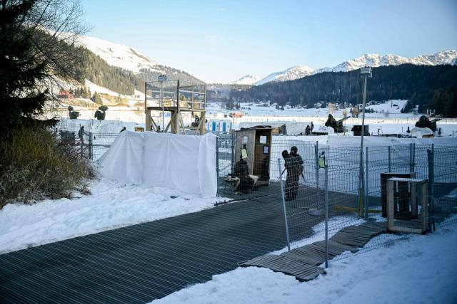This photograph taken through the window of a train shows the helicopter landing place in the Alpine resort of Davos during the World Economic Forum (WEF) annual meeting on January 20, 2026. The World Economic Forum takes place in Davos from January 19 to January 23, 2026. (Photo by INA FASSBENDER / AFP)