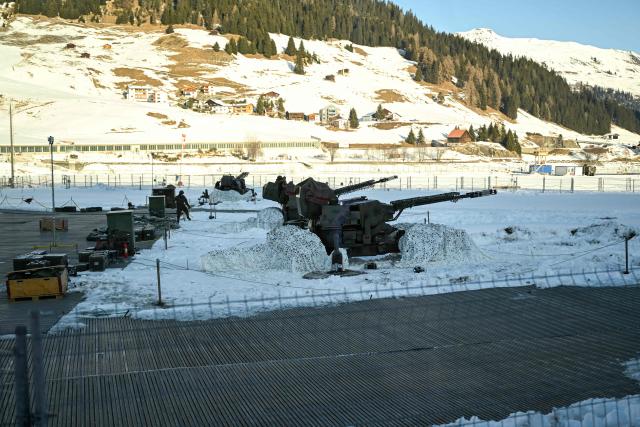 This photograph taken through the window of a train shows the helicopter landing place in the Alpine resort of Davos during the World Economic Forum (WEF) annual meeting on January 20, 2026. The World Economic Forum takes place in Davos from January 19 to January 23, 2026. (Photo by INA FASSBENDER / AFP)