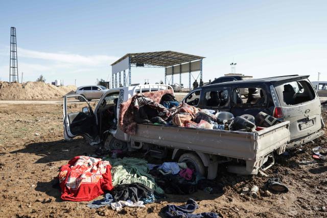 A photograph shows bullet-riddled vehicles on the side of a road in the area of Khirbat At Tamr, south of the city of Hasakeh in northeastern Syria, on January 20, 2026, as Syrian government forces head towards the city. Negotiations have collapsed between the Syrian president and the chief of the country's Kurdish-led forces, a Kurdish official told AFP, as the army deployed reinforcements to flashpoint areas in the north. (Photo by Bakr ALkasem / AFP)