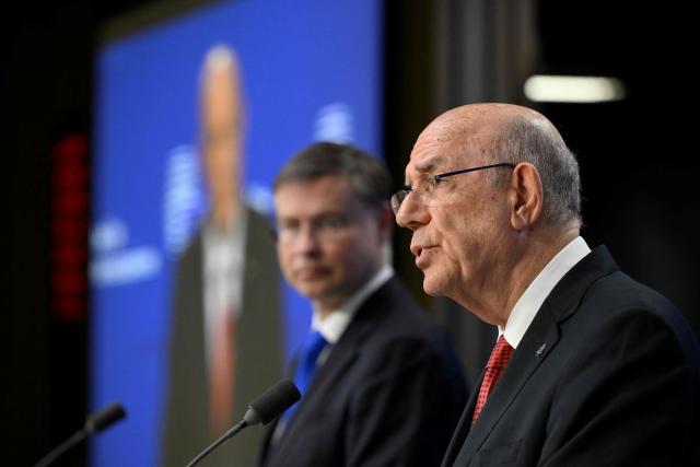 EU Commissioner for Economy and Productivity, Implementation and Simplification Valdis Dombrovskis (L) and Cyprus' Finance Minister and Acting President of the Eurogroup Makis Keravnos give a press conference during the Ecofin Economic and Financial Affairs Council, at the EU headquarters in Brussels, on January 20, 2026. (Photo by JOHN THYS / AFP)