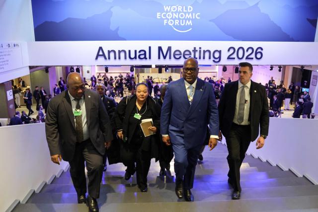 Democratic Republic of the Congo's President Felix Tshisekedi (C) walks inside the Congress hall during the World Economic Forum (WEF) annual meeting in Davos on January 20, 2026. The World Economic Forum takes place in Davos from January 19 to January 23, 2026. (Photo by Ludovic MARIN / AFP)