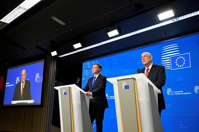 EU Commissioner for Economy and Productivity, Implementation and Simplification Valdis Dombrovskis (L) and Cyprus' Finance Minister and Acting President of the Eurogroup Makis Keravnos give a press conference during the Ecofin Economic and Financial Affairs Council, at the EU headquarters in Brussels, on January 20, 2026. (Photo by JOHN THYS / AFP)