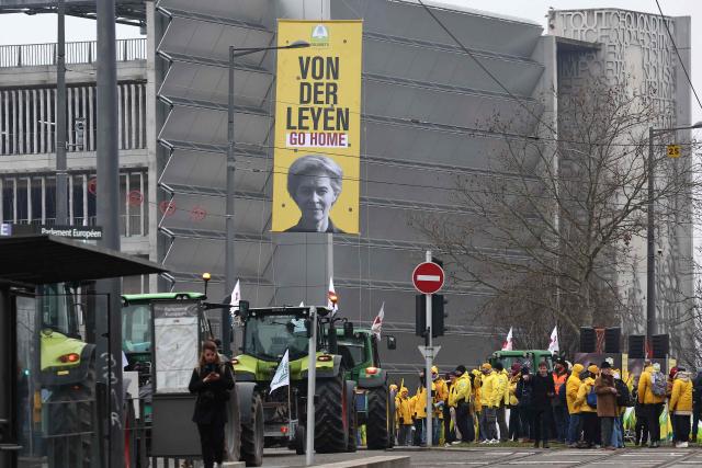 European Commission President Ursula von der Leyen is featured on a banner as European farmers gather outside the European Parliamen to protest against the free trade agreement between the European Union and the Mercosur countries, on the eve of a vote on a referral to the courts, in Strasbourg on January 20, 2026. Called by the FNSEA, France's leading national agricultural union, some 4,000 farmers from across the European Union, including Italy, Belgium, and Germany, are expected to attend the protest. MEPs will not vote on the entire agreement with Mercosur until the coming months, but they are set to vote on Wednesday on whether to refer the matter to the Court of Justice of the European Union (CJEU). (Photo by FREDERICK FLORIN / AFP)