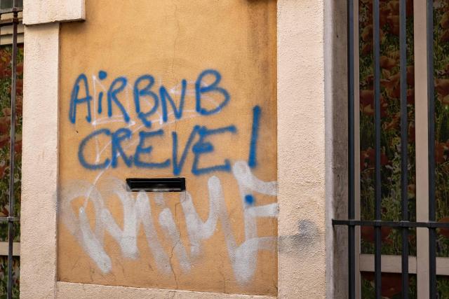 This photo shows a graffito reading "Airbnb die!" in downtown Marseille, southeastern France on January 20, 2026. (Photo by MIGUEL MEDINA / AFP)