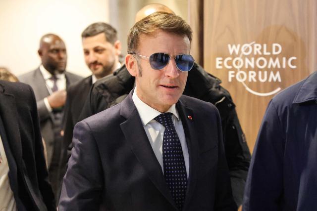 France's President Emmanuel Macron arrives for the World Economic Forum (WEF) annual meeting in the Congress center in Davos on January 20, 2026. The World Economic Forum takes place in Davos from January 19 to January 23, 2026. (Photo by Ludovic MARIN / AFP)