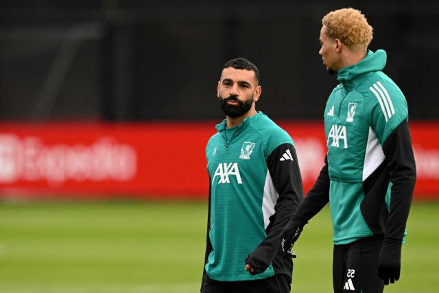 Liverpool's Egyptian striker #11 Mohamed Salah talks to Liverpool's French striker #22 Hugo Ekitike during a team training session at their training ground in Kirkby, Liverpool, north-west England on January 20, 2026, on the eve of their UEFA Champions League, league phase football match against Olympique Marseille in Marseille. (Photo by Oli SCARFF / AFP)