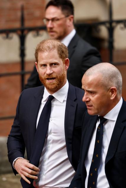 Britain's Prince Harry (L) departs from the High Court in London on January 20, 2026, after the second day the trial in his case against a major UK newspaper group. Prince Harry, pop icon Elton John and his husband David Furnish and four other high-profile figures are suing Associated Newspapers Ltd (ANL), the publisher of the Daily Mail and The Mail on Sunday, for privacy invasions. (Photo by Brook Mitchell / AFP)