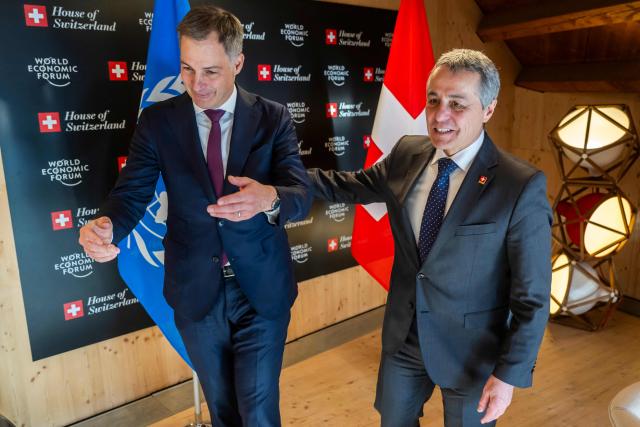 Switzerland's Foreign Minister Ignazio Cassis (R) welcomes Administrator of the United Nations Development Programme (UNDP) Belgian Alexander De Croo prior to a bilateral meeting during the World Economic Forum (WEF) annual meeting in Davos on January 20, 2026. The World Economic Forum takes place in Davos from January 19 to January 23, 2026. (Photo by LAURENT GILLIERON / POOL / AFP)