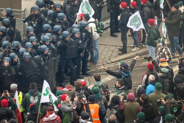 French riot Gendarmes mobiles confront protesters outside the European Parliament building during a protest against the free trade agreement between the European Union and the Mercosur countries, on the eve of a vote on a referral to the courts, in Strasbourg on January 20, 2026. Called by the FNSEA, France's leading national agricultural union, some 4,000 farmers from across the European Union, including Italy, Belgium, and Germany, are expected to attend the protest. MEPs will not vote on the entire agreement with Mercosur until the coming months, but they are set to vote on whether to refer the matter to the Court of Justice of the European Union (CJEU). (Photo by FREDERICK FLORIN / AFP)
