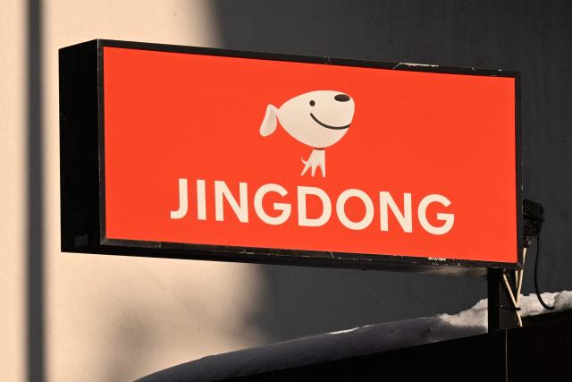 This photograph taken on January 20, 2026 shows signage bearing the JINGDONG retailer logo during the World Economic Forum (WEF) annual meeting in Davos. The World Economic Forum takes place in Davos from January 19 to January 23, 2026. (Photo by INA FASSBENDER / AFP)