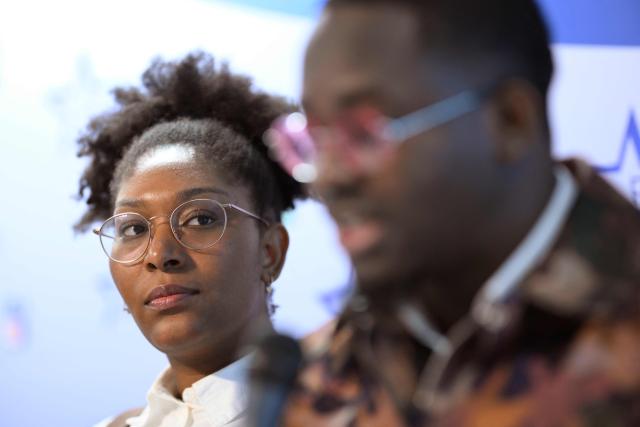 Murdered Congolese independence icon Patrice Lumumba's relatives Yema Lumumba (L) and Mehdi Lumumba (R) holds a press conference following a hearing before a Belgian court to weigh prosecuting the sole surviving suspect over the 1961 killing, in Brussels on January 19, 2026. Some 65 years after Lumumba was executed and his body dissolved in acid by separatists with the help of mercenaries from former colonial power Belgium, only one ex-official is still alive to face justice. That is 93-year-old Etienne Davignon, a one-time European commissioner, who was a novice Belgian diplomat at the time of Lumumba's killing. (Photo by JOHN THYS / AFP)