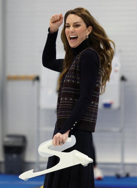Britain's Catherine, Princess of Wales reacts during a visit to meet with the Team GB and Paralympics GB Curling teams, ahead of the Winter Olympic Games, at the National Curling Academy in Stirling, in Scotland on January 20, 2026. (Photo by Russell Cheyne / POOL / AFP)