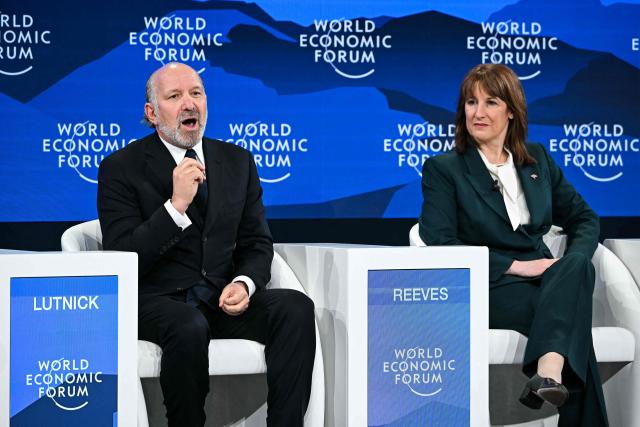 US Commerce Secretary Howard Lutnick speaks next to Britain's Chancellor of the Exchequer Rachel Reeves during the World Economic Forum (WEF) annual meeting in Davos on January 20, 2026. The World Economic Forum takes place in Davos from January 19 to January 23, 2026. (Photo by Fabrice COFFRINI / AFP)