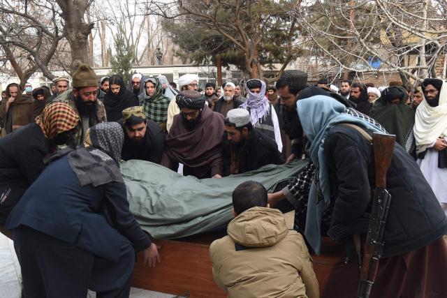 Taliban personnel carry the shrouded body of the Chinese victim who died in an explosion of a Chinese restaurant in the Shahr-e Naw area, during a funeral ceremony in the Wazir Akbar Khan Mosque in Kabul on January 20, 2026. Mourners gathered on January 20 for the funeral of a Chinese man killed in a restaurant bombing in central Kabul, where Afghans were picking up the pieces of their shattered shops. (Photo by Bais YUSUFI / AFP)