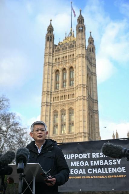 Hong Kong former veteran labour activist Christopher Mung Siu-tat speaks during a press conference concerning the decision on the new Chinese embassy, outside the Houses of Parliament in central London on January 20, 2026. The UK government on January 20 gave the green light for China to build a "mega embassy" in the historic heart of London, eight years after the process began and despite fierce opposition from residents and rights groups. (Photo by JUSTIN TALLIS / AFP)
