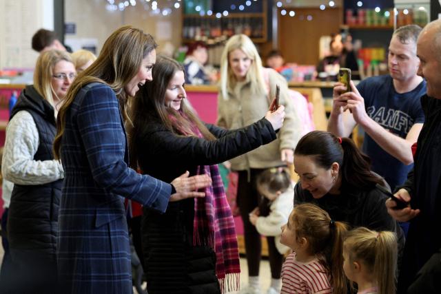 Britain's Catherine, Princess of Wales poses for a selfie photo during her visit at the National Curling Academy in Stirling, in Scotland on January 20, 2026. (Photo by Russell Cheyne / POOL / AFP)