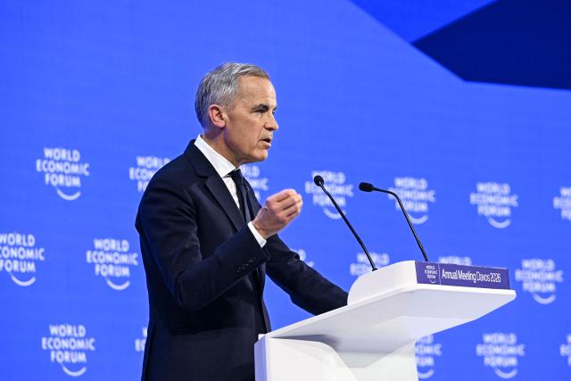Canada's Prime Minister Mark Carney delivers a speech during the World Economic Forum (WEF) annual meeting in Davos on January 20, 2026. The World Economic Forum takes place in Davos from January 19 to January 23, 2026. (Photo by Fabrice COFFRINI / AFP)