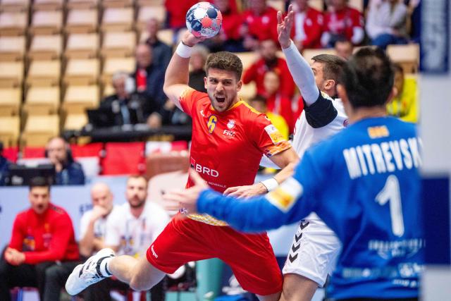 Romania's left back #06 Tudor Botea shoots the ball during the EHF Euro 2026 Group B preliminary round handball match between North Macedonia and Romania in Herning, Denmark, on January 20, 2026. (Photo by Bo Amstrup / Ritzau Scanpix / AFP) / Sweden OUT