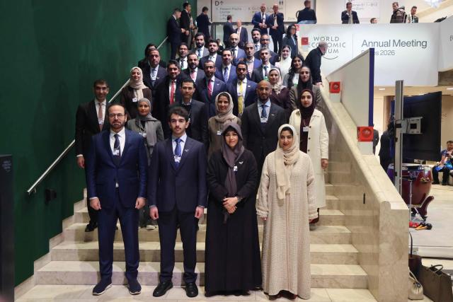 The United Arab Emirates delegation poses for a photograph on a staircase during the World Economic Forum (WEF) annual meeting in Davos on January 20, 2026. The World Economic Forum takes place in Davos from January 19 to January 23, 2026. (Photo by Ludovic MARIN / AFP)