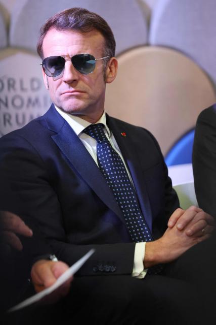 France's President Emmanuel Macron attends a meeting with CEOs of AI companies during the World Economic Forum (WEF) annual meeting in Davos on January 20, 2026. The World Economic Forum takes place in Davos from January 19 to January 23, 2026. (Photo by Ludovic MARIN / AFP)