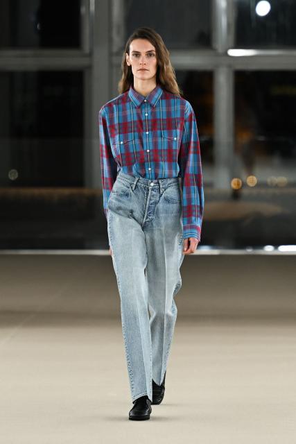 A model presents a creation for the Auralee Menswear Ready-to-wear Fall-Winter 2026/2027 collection as part of the Paris Fashion Week in Paris on January 20, 2026. (Photo by Blanca CRUZ / AFP)