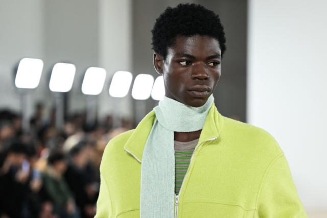 A model presents a scarf by the Auralee Menswear Ready-to-wear Fall-Winter 2026/2027 collection as part of the Paris Fashion Week in Paris on January 20, 2026. (Photo by Blanca CRUZ / AFP)