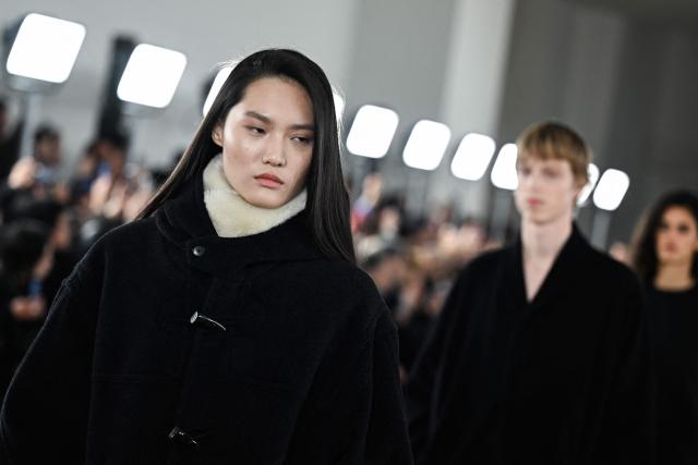 Models present creations for the Auralee Menswear Ready-to-wear Fall-Winter 2026/2027 collection as part of the Paris Fashion Week in Paris on January 20, 2026. (Photo by Blanca CRUZ / AFP)
