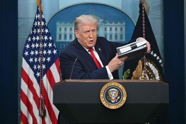 US President Donald Trump arrives during a briefing in the Brady Briefing Room of the White House in Washington, DC, on January 20, 2026. The White House said President Donald Trump will hold a press conference Tuesday exactly a year into his second term, amid acute international tension over his drive to take over Greenland. (Photo by SAUL LOEB / AFP)