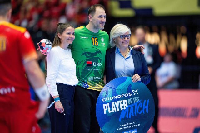 Romania's goalkeeper #16 Mihai Catalin Popescu is named the player of the match after the EHF Euro 2026 Group B preliminary round handball match between North Macedonia and Romania in Herning, Denmark, on January 20, 2026. (Photo by Bo Amstrup / Ritzau Scanpix / AFP) / Denmark OUT