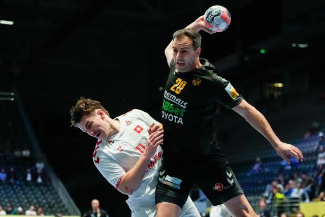 Montenegro's centre back #20 Stevan Vujovic shoots during the EHF Euro 2026 group D preliminary round handball match between Montenegro and Switzerland in Baerum near Oslo, Norway, on January 20, 2026. (Photo by Erik Flaaris Johansen / NTB / AFP) / Norway OUT
