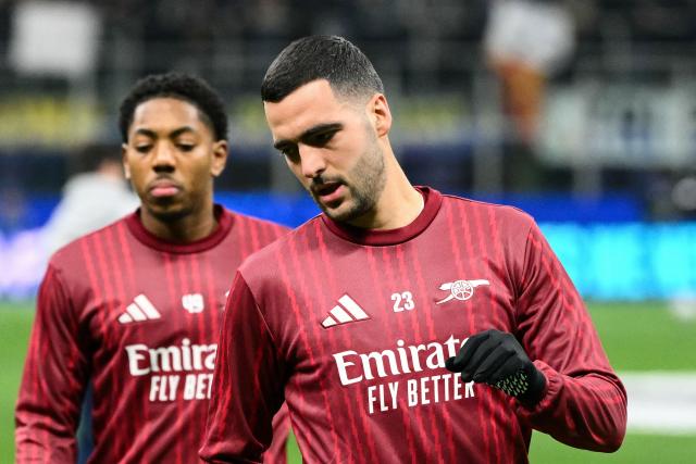 Arsenal's Spanish midfielder #23 Mikel Merino warms up prior to the UEFA Champions League, league phase day 7, football match between Inter Milan and Arsenal at San Siro stadium in Milan, northern Italy, on January 20, 2026. (Photo by Alberto PIZZOLI / AFP)
