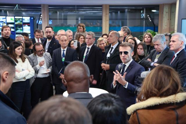 France's President Emmanuel Macron speaks to business leaders at the Business France event during the World Economic Forum (WEF) annual meeting in Davos on January 20, 2026. The World Economic Forum takes place in Davos from January 19 to January 23, 2026. (Photo by Ludovic MARIN / AFP)