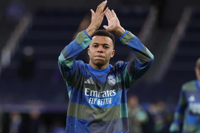 Real Madrid's French forward #10 Kylian Mbappe applauds during the warmup before the UEFA Champions League league phase day 7 football match between Real Madrid CF and AS Monaco at Santiago Bernabeu Stadium in Madrid on January 20, 2026. (Photo by Thomas COEX / AFP)