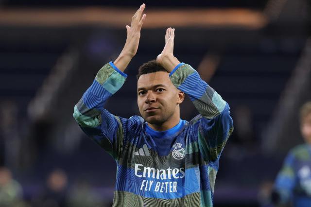 Real Madrid's French forward #10 Kylian Mbappe applauds during the warmup before the UEFA Champions League league phase day 7 football match between Real Madrid CF and AS Monaco at Santiago Bernabeu Stadium in Madrid on January 20, 2026. (Photo by Thomas COEX / AFP)